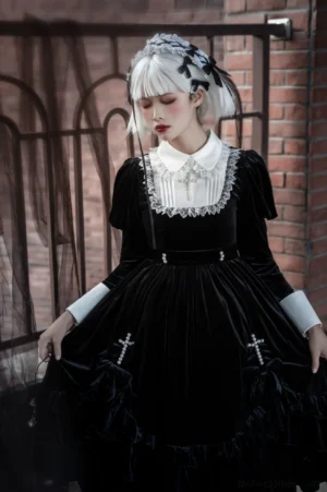 Black Gothic Lolita one-piece dress back three-quarter angle showing fitted waist, decorative buckles, cross embellishment, and classic A-line Lolita silhouette