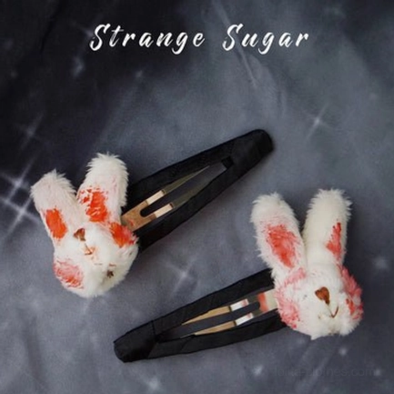 Bloody rabbit snap lolita hair clips plush white rabbit with blood stain details black metal snap mechanism dark gray background