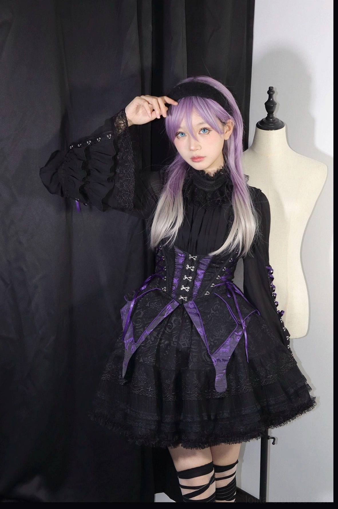 Gothic lolita blouse back view showing functional back zipper detail, long bishop sleeve construction with cuff details, high-neck collar, and slim-fit silhouette design