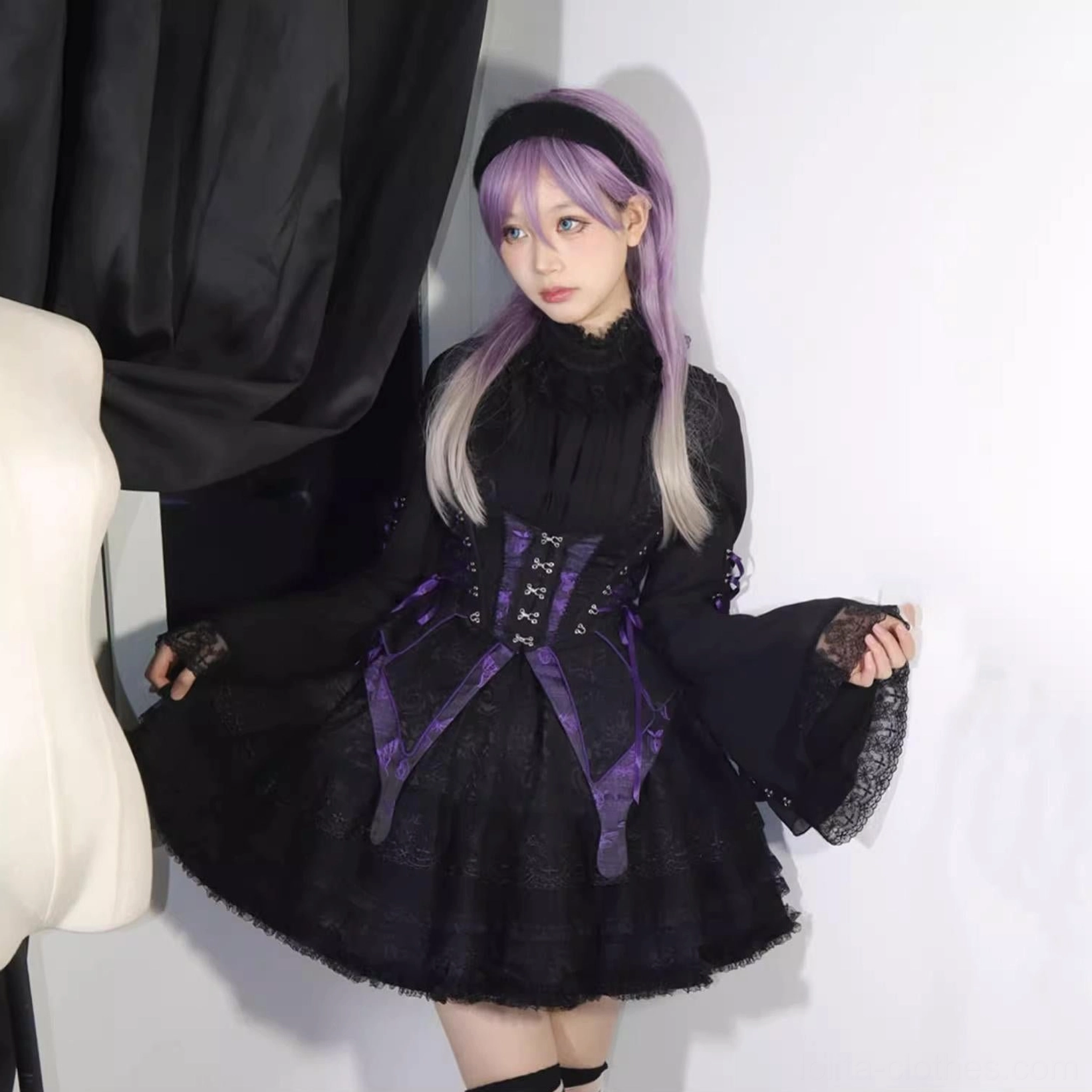 Detailed front view of gothic lolita blouse showing stand collar, lace ruffle neckline trim, puff sleeve gathering, drawstring sleeve detail, and butterfly-pattern lace cuff design