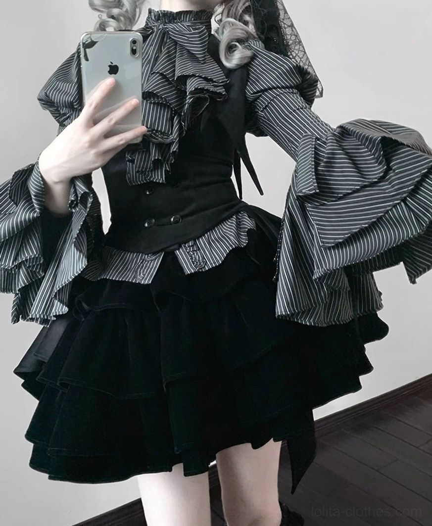Detail shot of lace-up puffed sleeve on Gothic Lolita blouse showing intricate trim work and lace-up closure mechanism characteristic of princess sleeve design