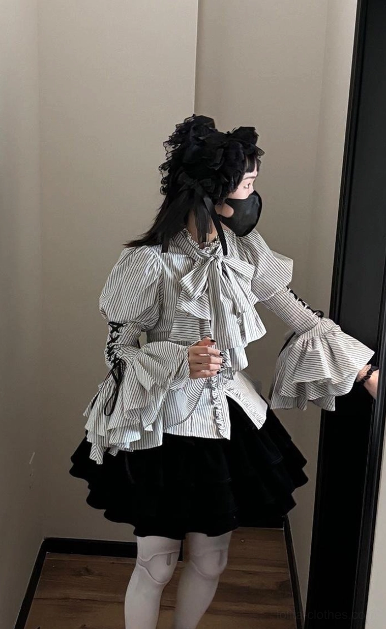 Side profile view of structured puffed princess sleeve on Gothic Lolita blouse showing lace-up detailing and sleeve volume characteristic of Lolita fashion aesthetic