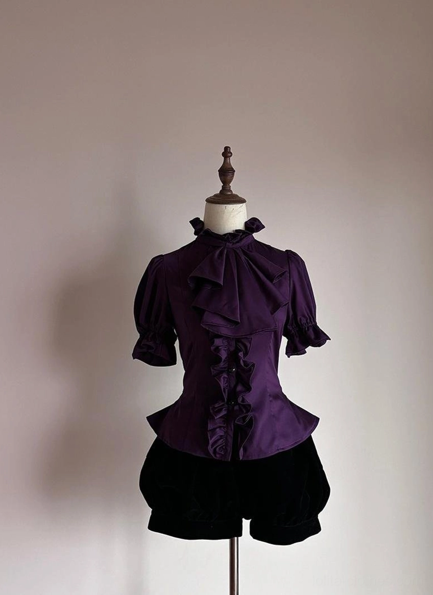 Close-up detail of removable jabot neckline element on Gothic Lolita short-sleeve blouse showing ruffled design and attachment