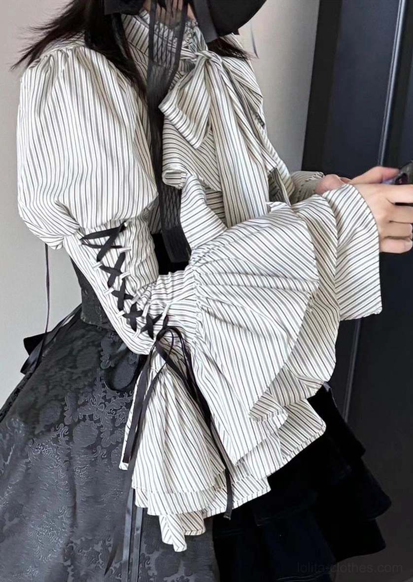 Shoulder and sleeve detail of Gothic Lolita blouse highlighting narrow shoulder design and princess puff sleeve volume with lace-up trim characteristic of style