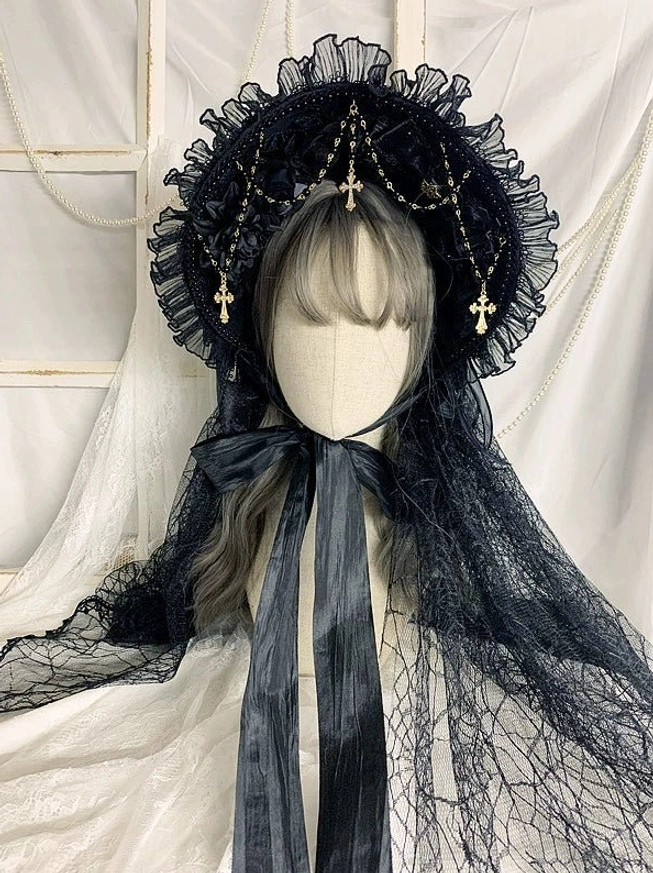Gothic Lolita bonnet with attached black sheer mesh veil front view, cross charm chains, ruffled lace brim, dark satin ties with full back veil