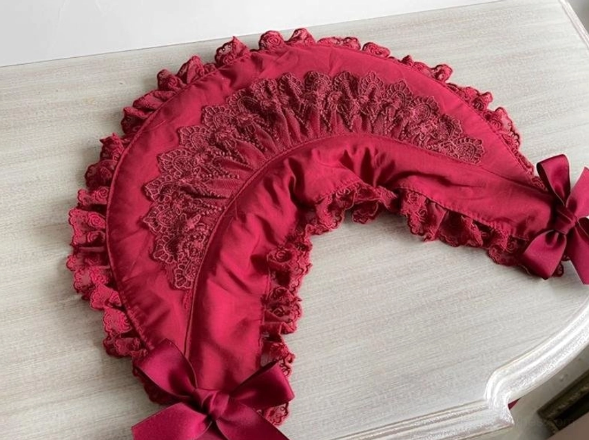 Gothic lolita lace bonnet satin ribbon bow and rosette embellishments, decorative details characteristic of lolita fashion