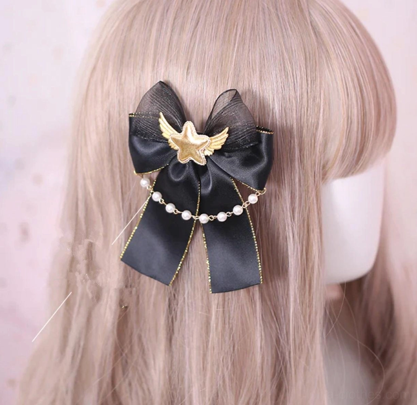gothic lolita bow hairclip back view on blonde mannequin wig with black satin bow gold trim pearl chain star wing brooch
