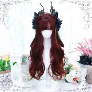 Gothic Lolita burgundy long curly wig with blunt bangs displayed on mannequin head with black feather hair accessories and floral backdrop