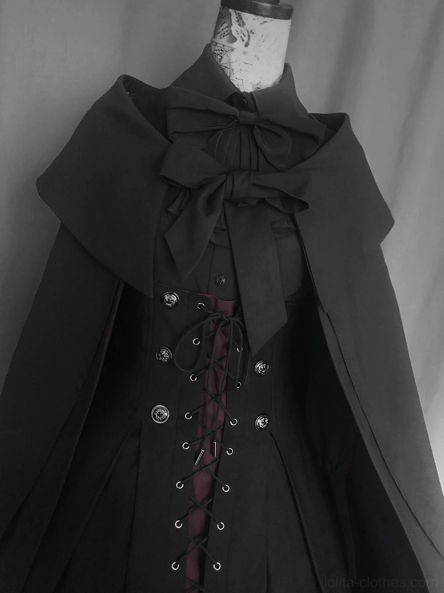Gothic Lolita cape with bow detail showing sophisticated collar attachment and cape construction quality