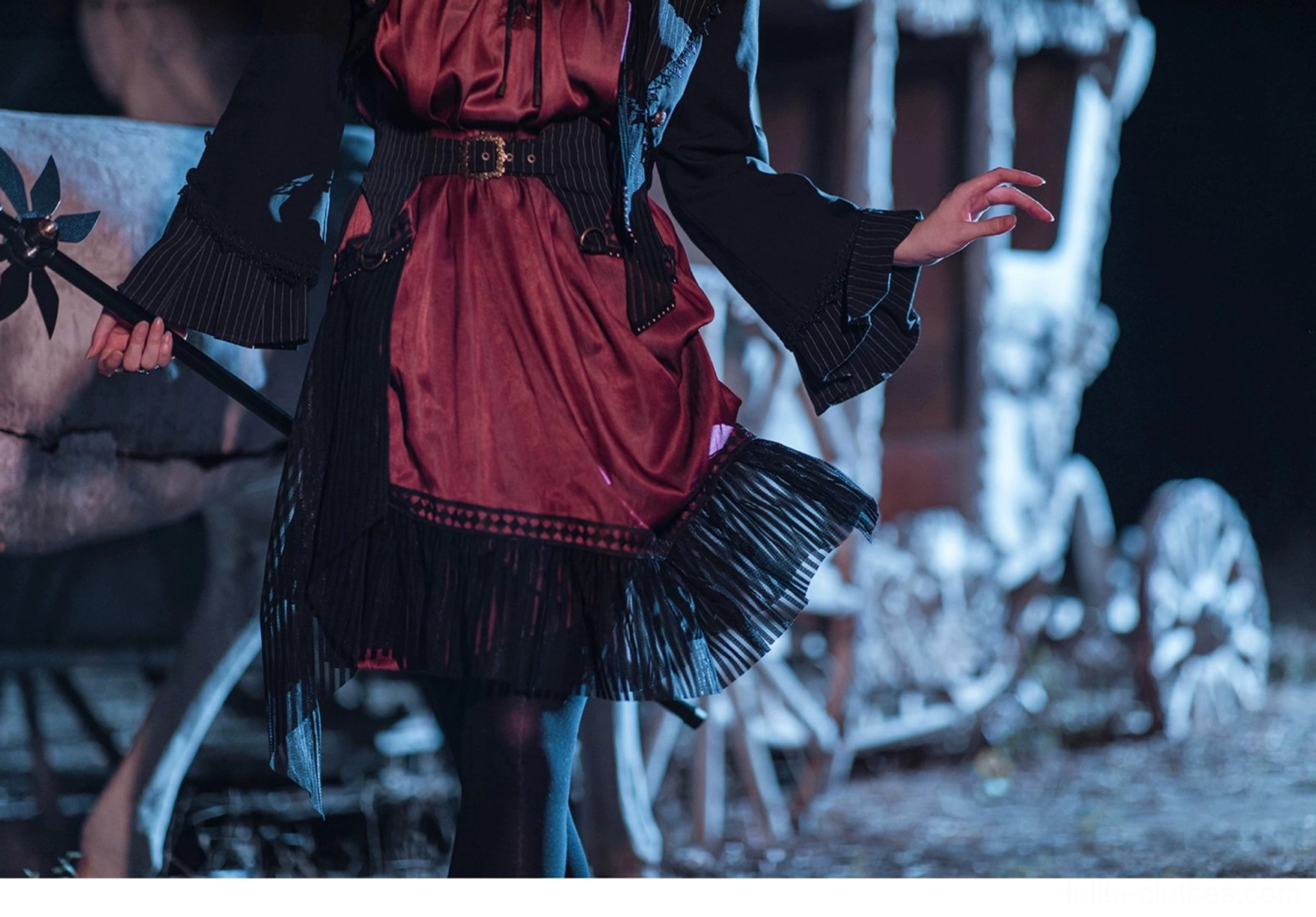 Gothic Lolita cardigan jacket side profile view showing silhouette flared sleeve tailored collar structure design