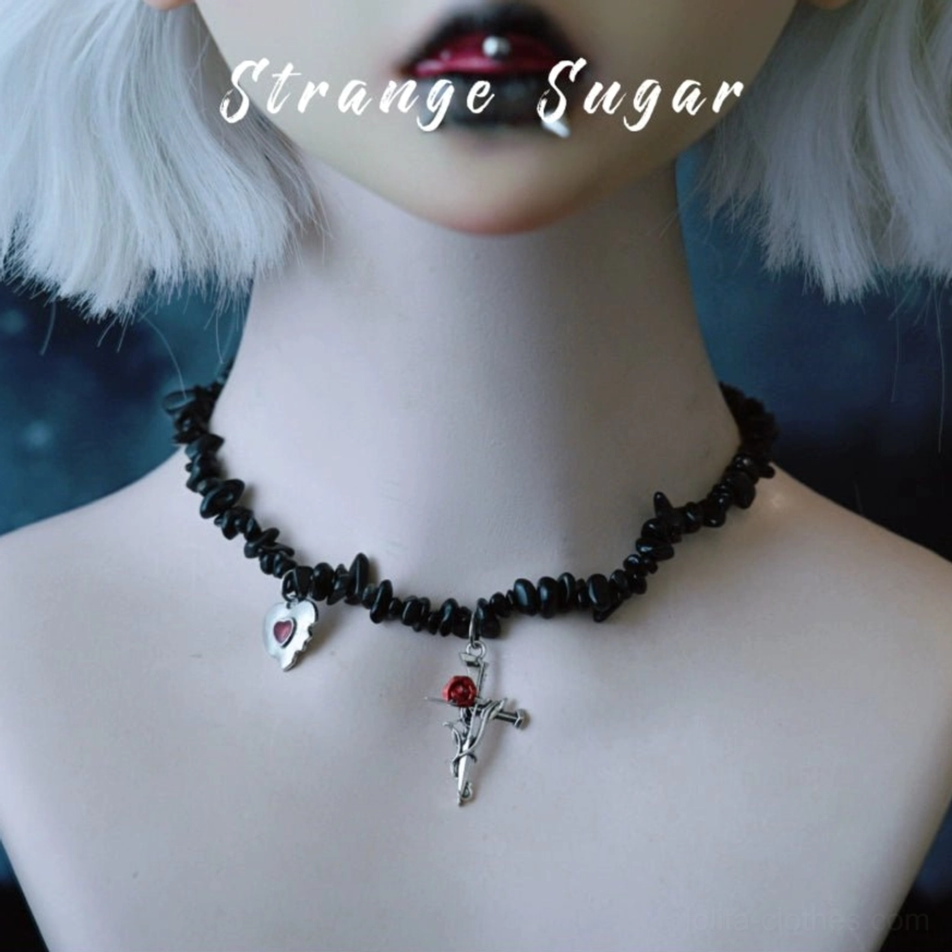 Gothic lolita choker displayed on doll model with silver grey bob wig, featuring obsidian chain with dual pendants tiny heart and crucifix cross, dark aesthetic styling