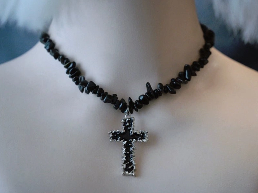 Gothic lolita choker with black crushed stone chain and vintage silver religious cross pendant, dark religious gothic aesthetic on mannequin display