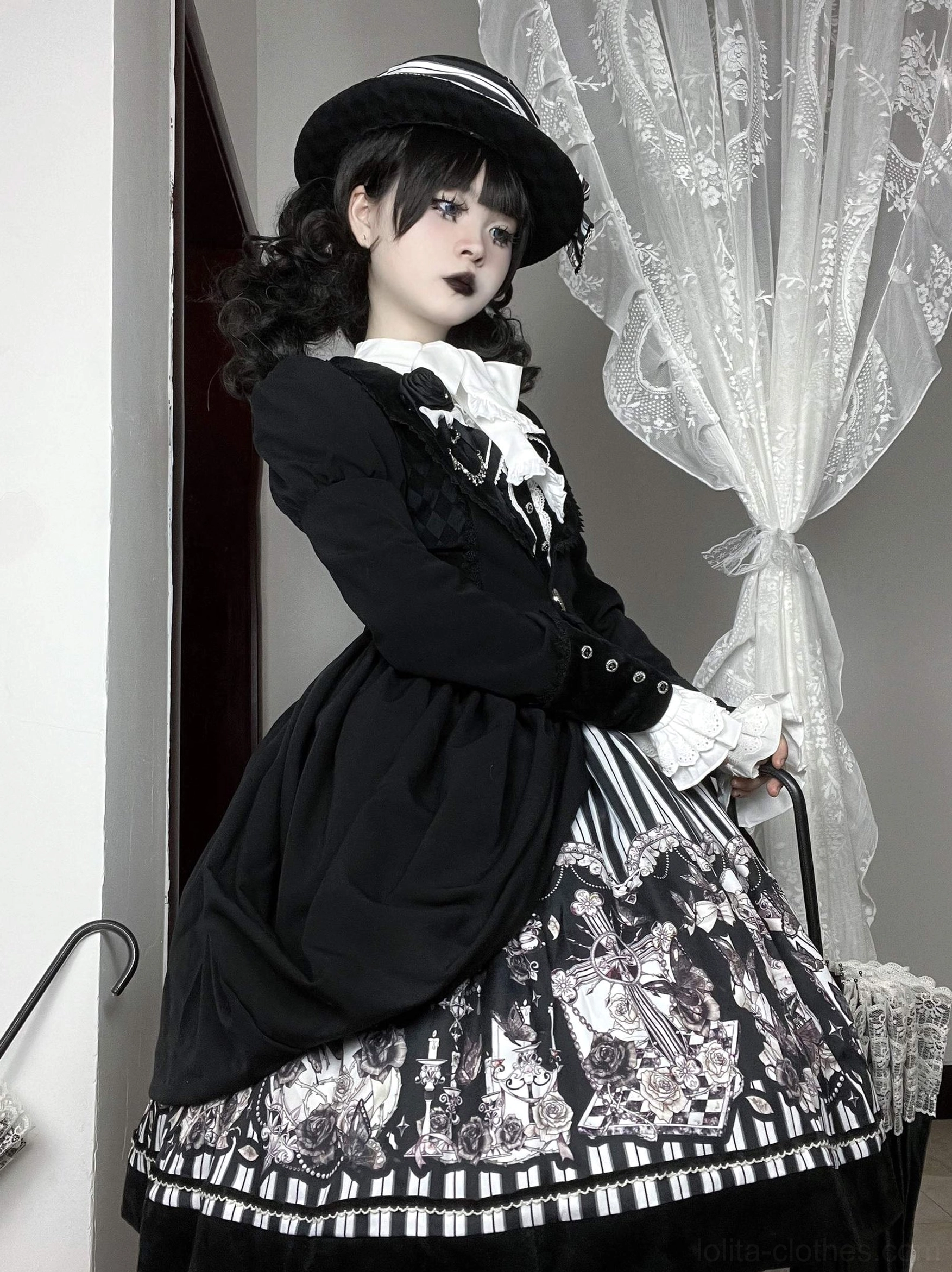 Gothic Lolita coat JSK dress side three-quarter standing view gothic curly twin hairstyle fitted waist full vintage printed skirt
