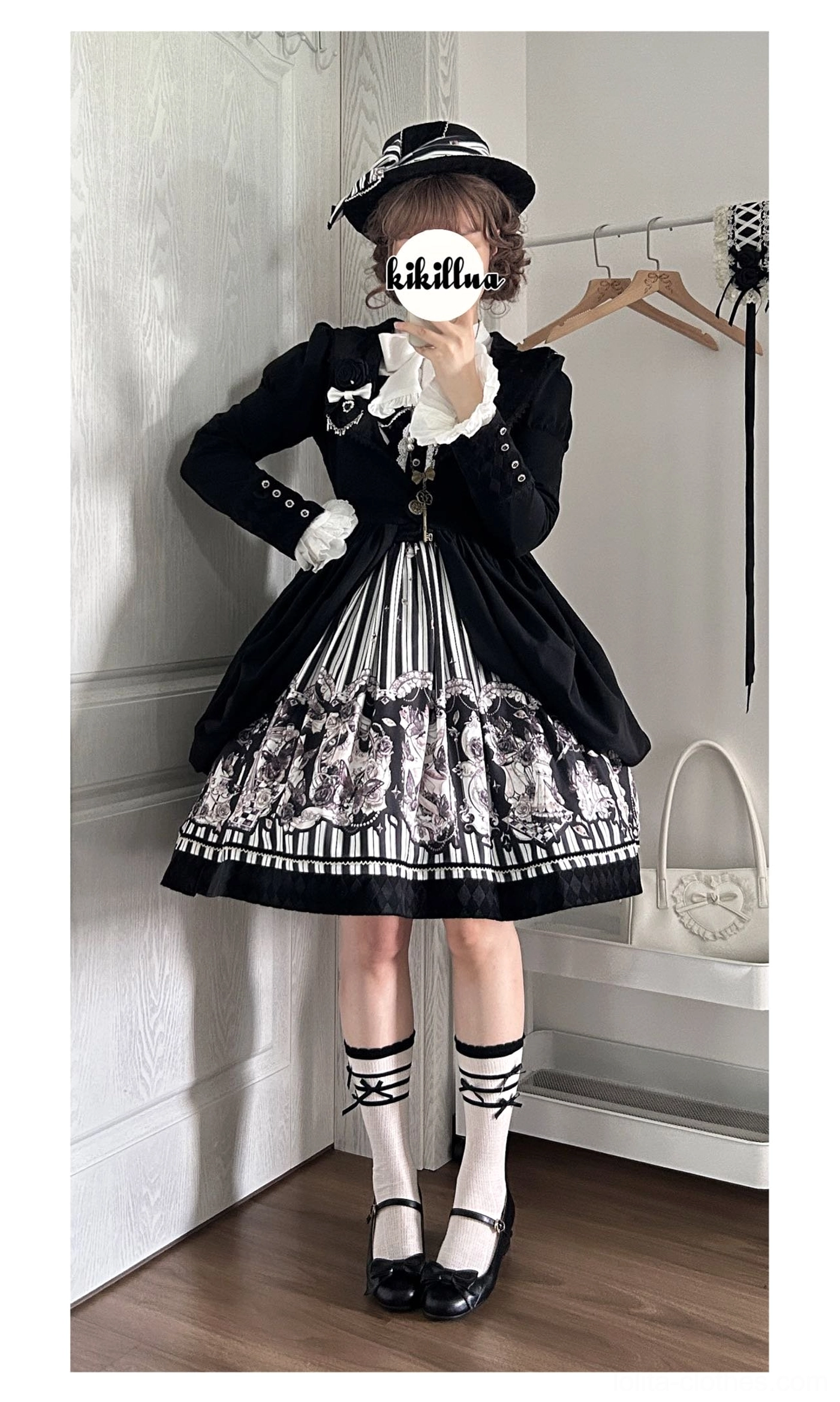 Gothic Lolita coat and vintage printed skirt set worn with striped socks Mary Jane shoes top hat indoor full body view