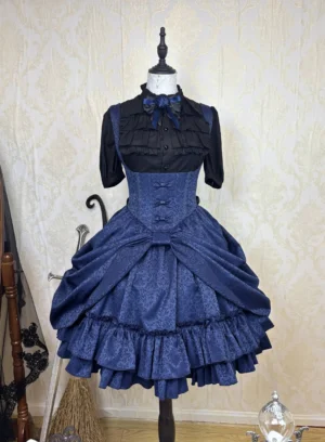 Dark navy blue Gothic Lolita corset jumper skirt displayed on dress mannequin showing patterned jacquard fabric texture and layered ruffled hem details