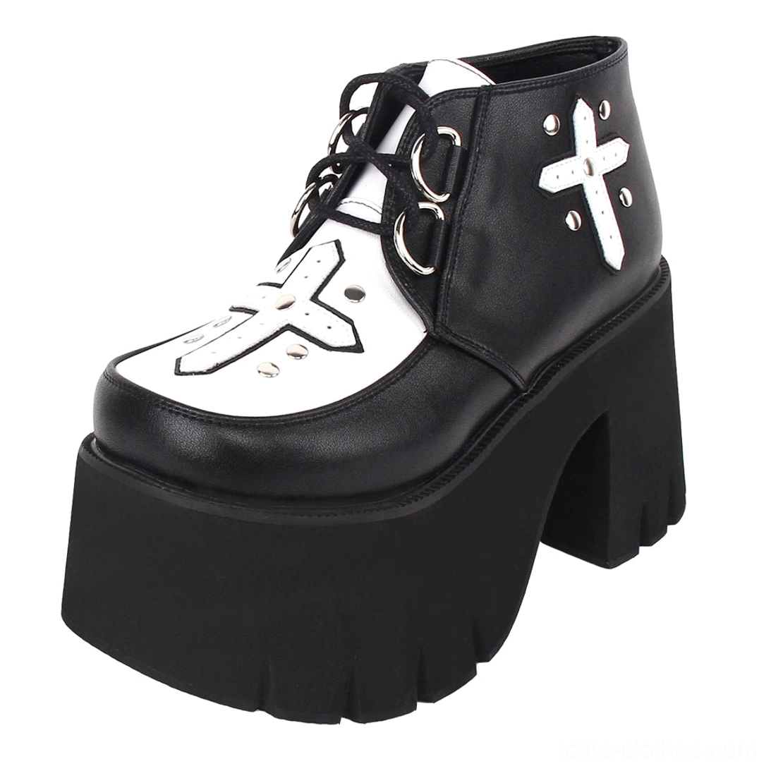 Gothic lolita cross platform boots front three-quarter view showing black and white color blocking with silver stud-studded cross applique and chunky lug platform heel