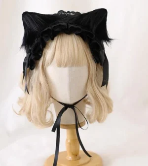 Gothic Lolita lace headdress featuring removable black cat ears and matching black satin bows and neck strap, displayed on mannequin front angle