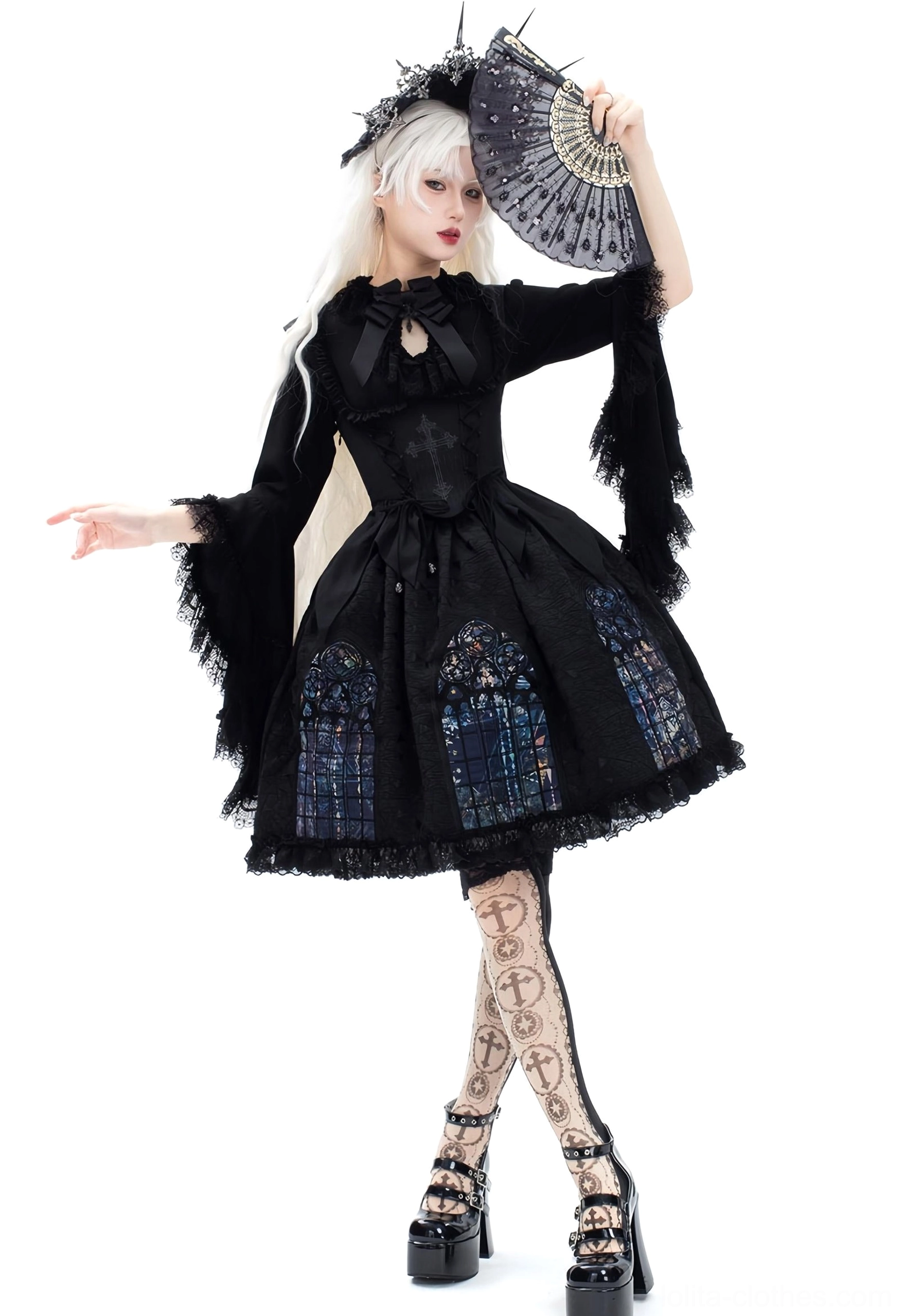 Black gothic lolita dress flared bishop sleeves neck bow platform high heels printed fishnet stockings single model side view white background