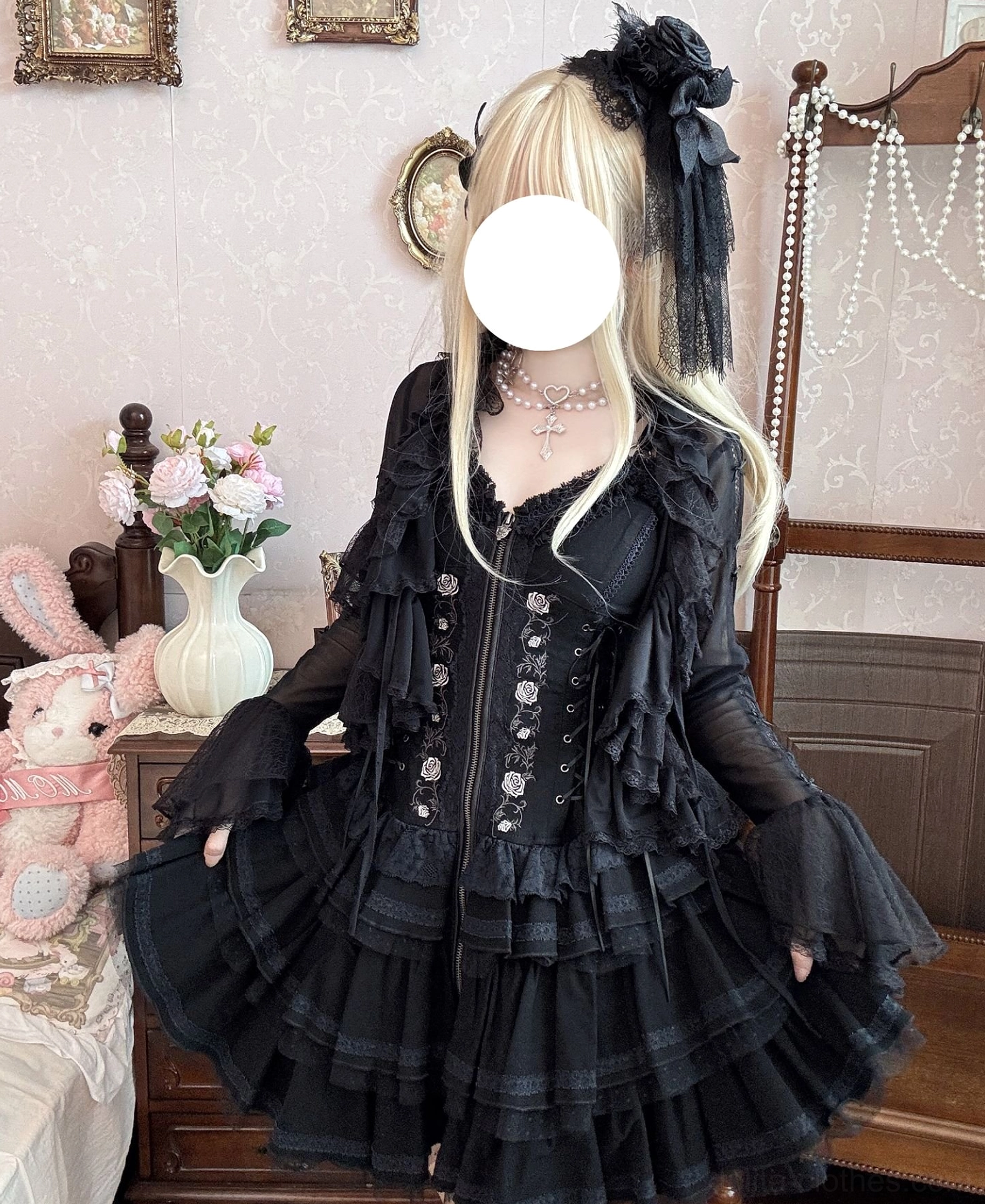 Side profile half-body view of gothic black lolita dress with tulle bolero, showing volume of tiered ruffle skirt and sheer flared bell sleeves with delicate bodice
