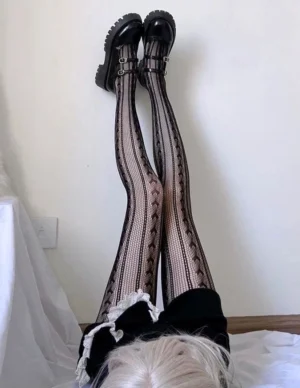 overhead view gothic lolita vertical heart hollow mesh black tights with lace bow waist detail