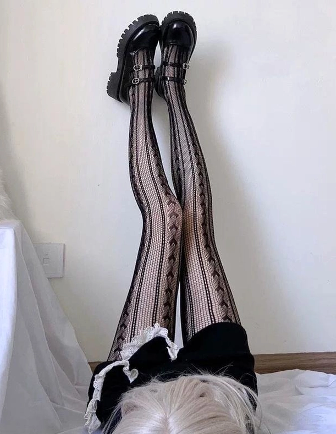 overhead view gothic lolita vertical heart hollow mesh black tights with lace bow waist detail