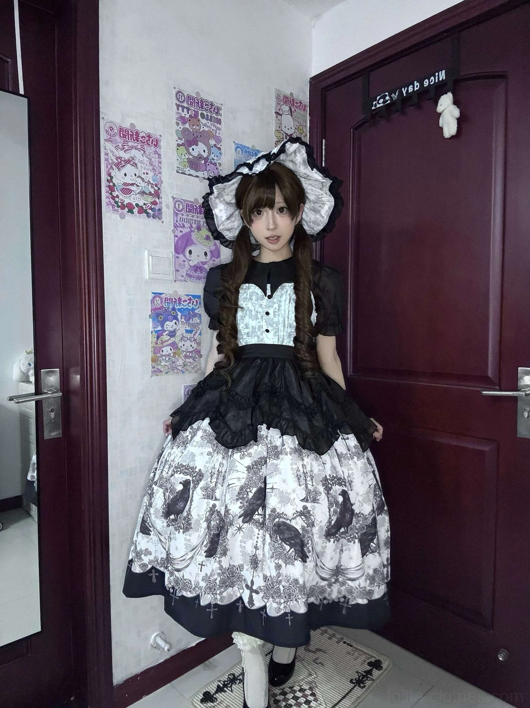 Complete gothic lolita coordinate featuring crow print JSK dress with ruffled black blouse and big bow headbow matching fabric accents