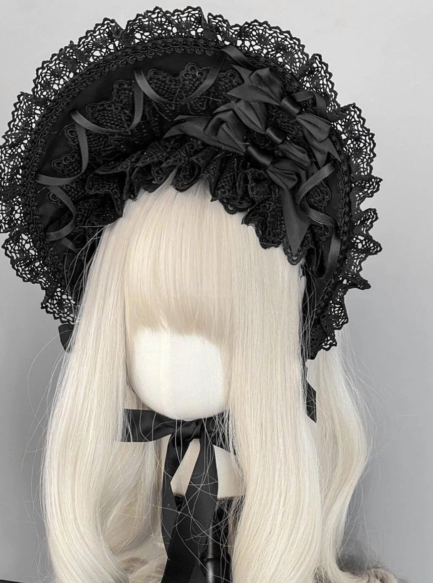Gothic lolita full lace bonnet front direct view with fully ruffled lace brim, multiple satin bows, black color, matching chin strap bow