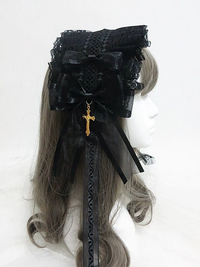 Gothic lolita KC hairband right rear angle showing black layered lace construction, large decorative bow with gold cross charm, and gracefully flowing sheer ribbon tails with lace trim