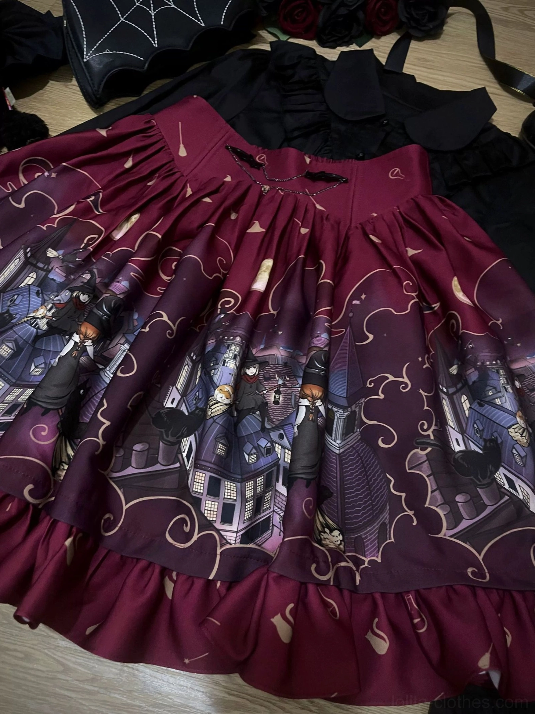 Flat lay overhead view wine red burgundy Gothic Lolita Halloween SK skirt with high waist ruffled hem vintage witch town Halloween print golden vine patterns