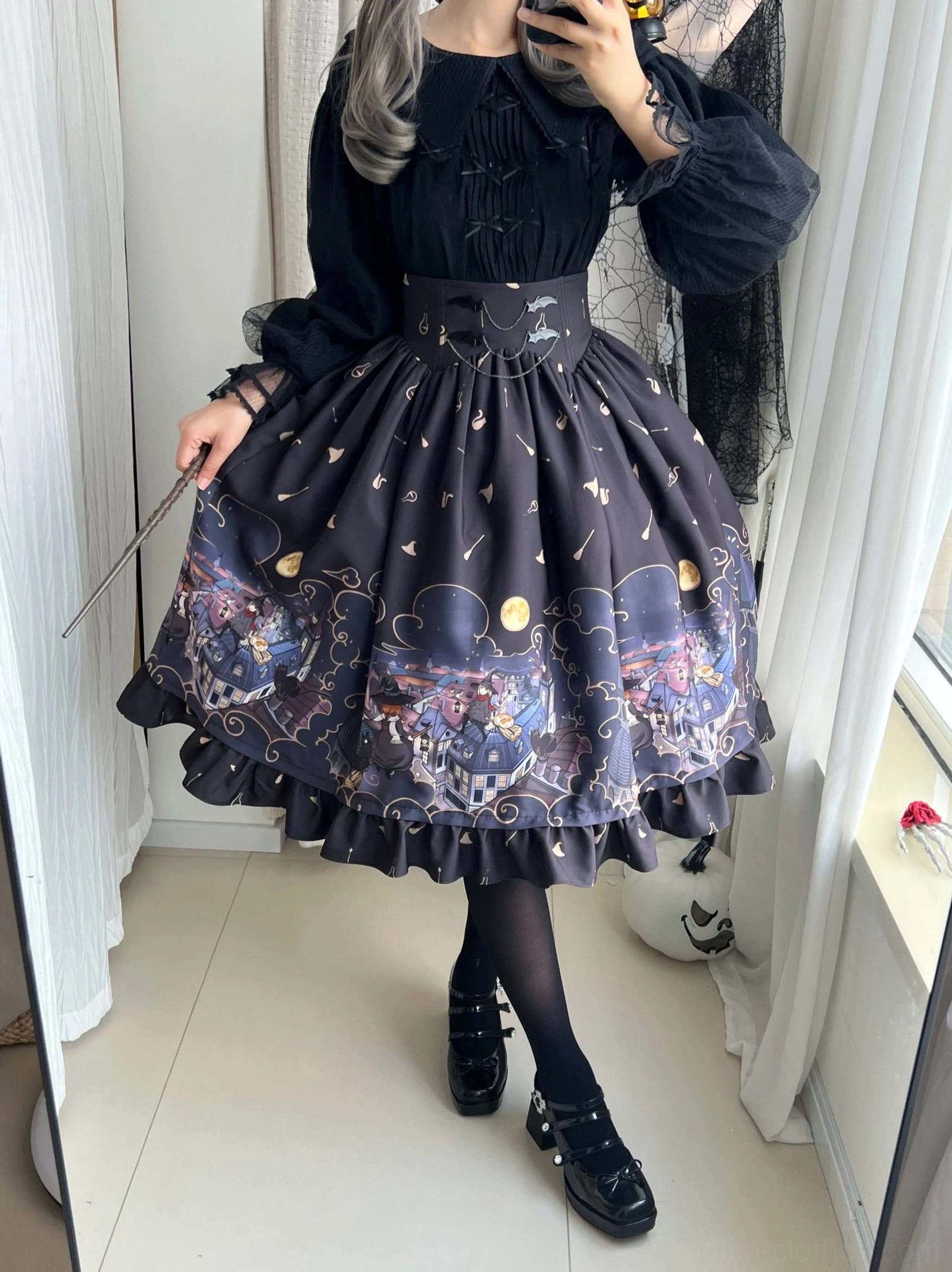 Model side view holding magic wand wearing dark purple Gothic Lolita Halloween SK skirt ruffles chiffon with puff-sleeve black blouse platform shoes