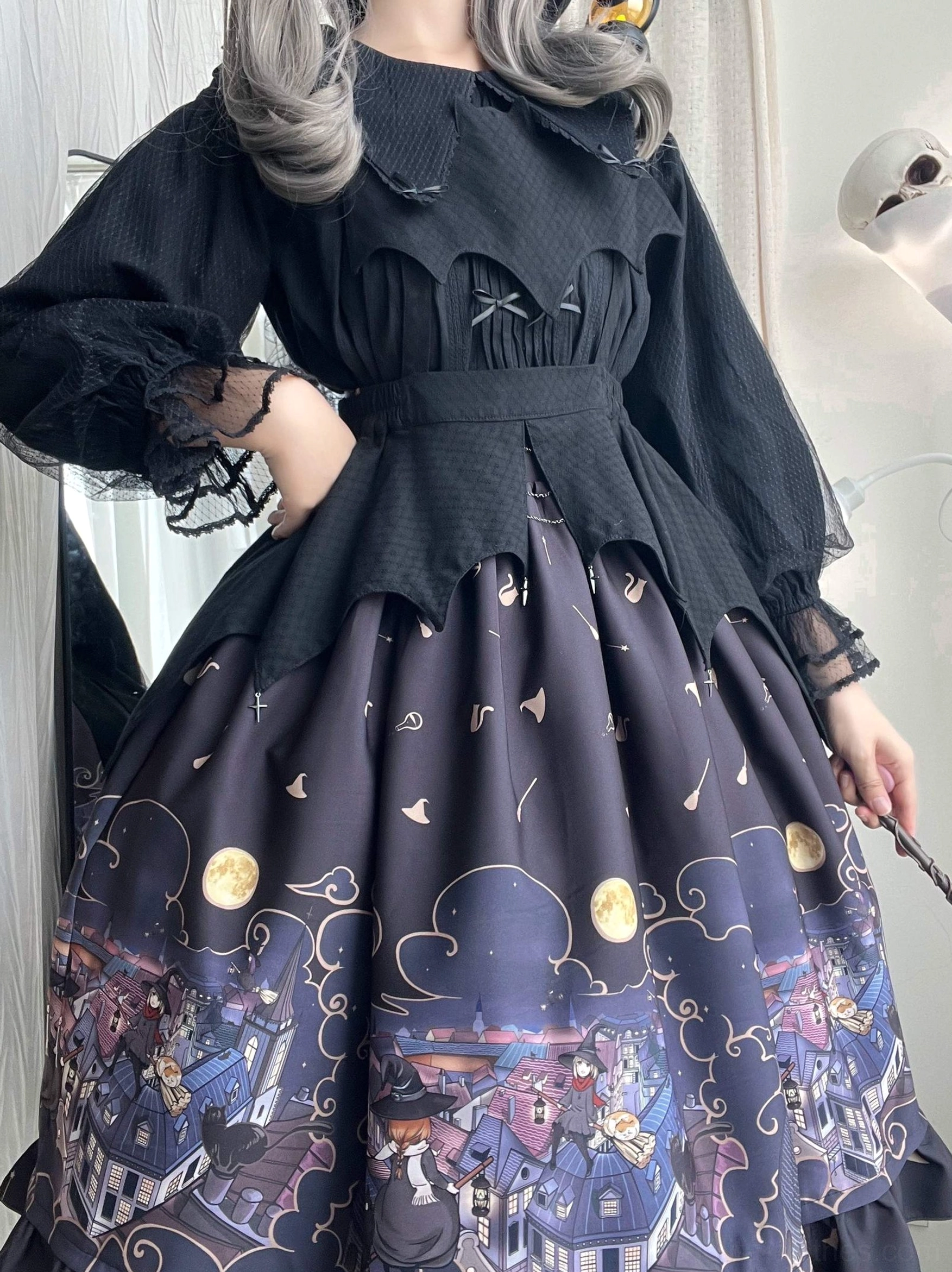 Back side view blonde model wearing wine red Gothic Lolita SK Halloween skirt with ruffled hem black lace-cuff puff-sleeve blouse vintage witch aesthetic