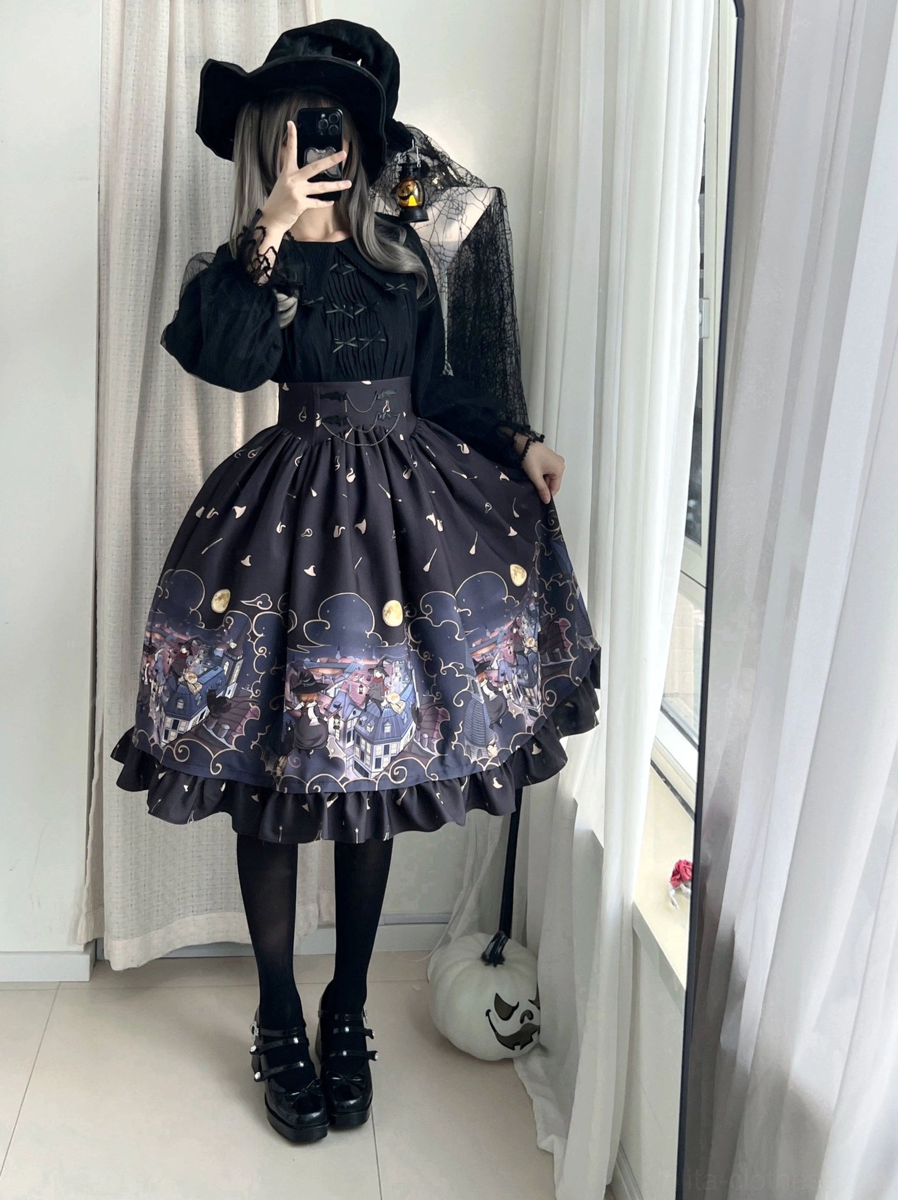 Mirror front shot model in dark purple Gothic Lolita Halloween SK skirt with ruffled hem wearing witch hat black blouse and tights spooky aesthetic