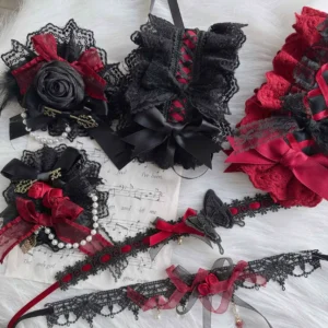 Complete handmade Gothic Lolita accessory collection flat lay featuring black mesh and wine-red cotton pieces with lace trims, satin bows, artificial roses and metal charms on painted sheet music backdrop