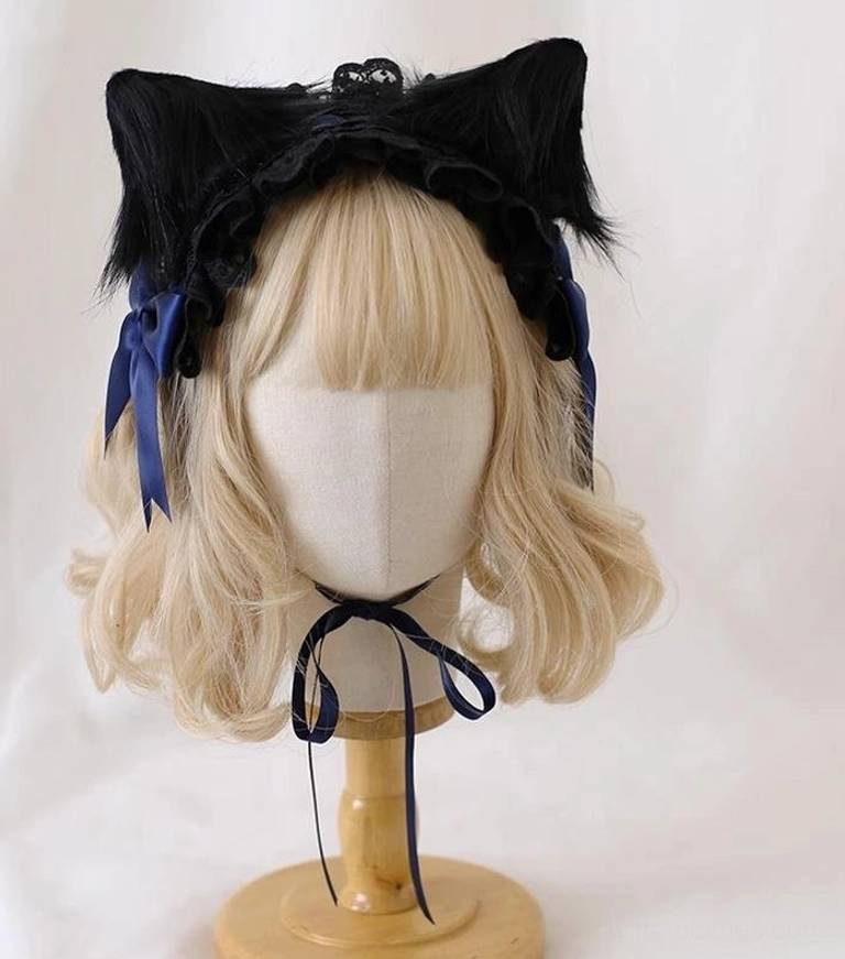 Gothic Lolita alternative fashion headband with dark blue satin bows, removable black cat ears, and signature black lace ruffled trim detail