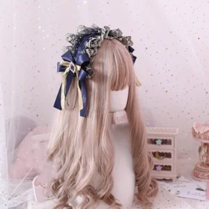 Navy blue and gold embroidered lace Gothic Lolita headband with satin bow and blue gemstone on blonde wig mannequin, starry backdrop with vintage miniature furniture