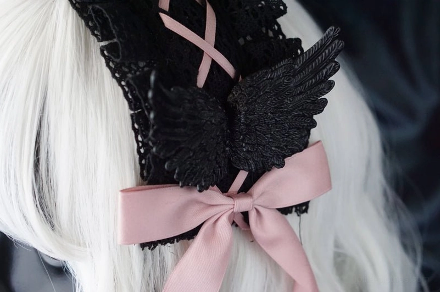 Cross-culturally inspired gothic lolita headdress combining victorian darkness with japanese subculture fashion elements and raven symbolism