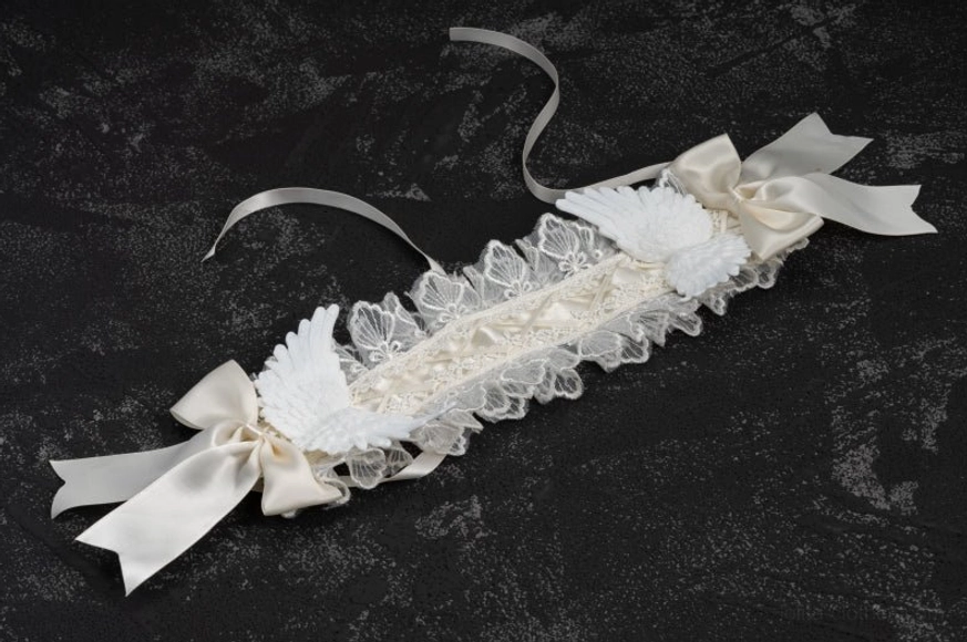 Lolita white lace angel wings gothic hairband close-up of satin bow and lace texture details, showcasing premium fabric quality and craftsmanship