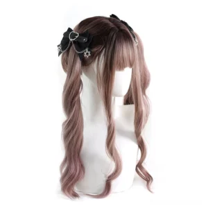 Gothic Lolita heart metal hair clip displayed on long wavy brown hair mannequin, featuring black bow design with heart-shaped metal ornament and star-shaped chain pendants