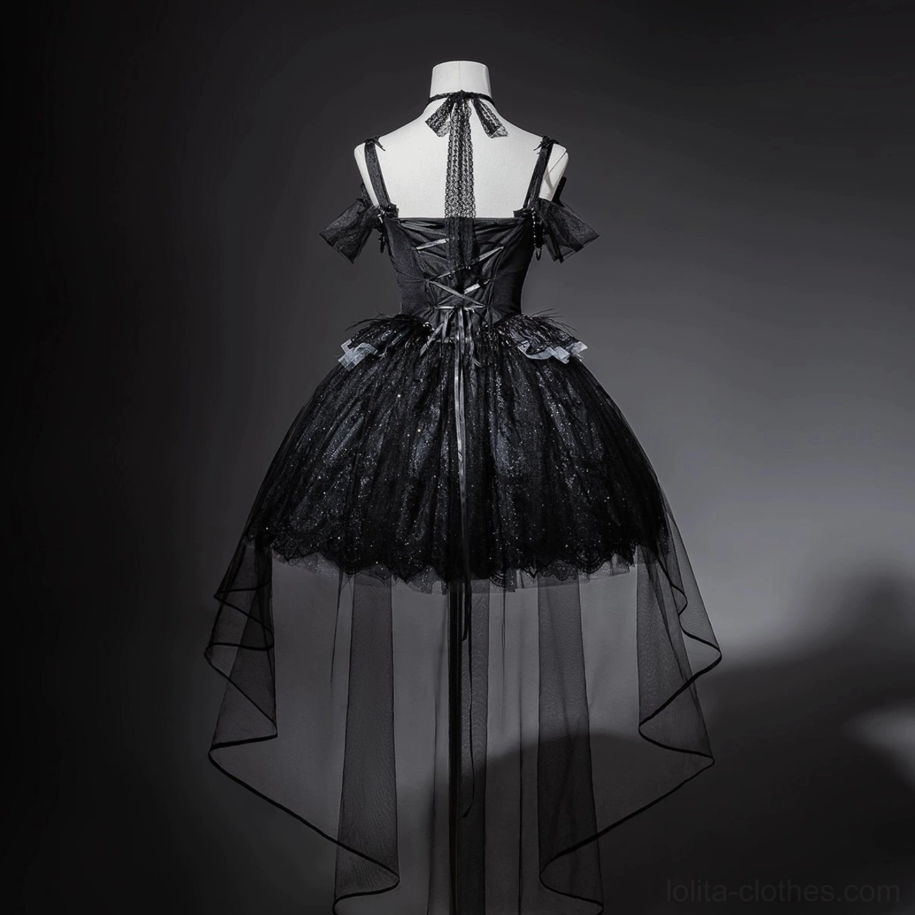 Black gothic lolita JSK dress rear view on mannequin showing lace-up back closure, adjustable off-shoulder spaghetti straps, and sheer high-low tulle train