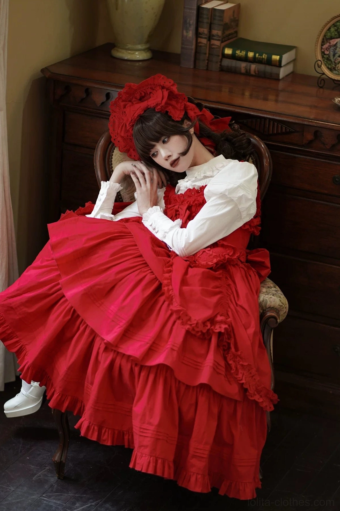 Detailed close-up of Gothic Lolita JSK tiered ruffles and drawn-up hem construction showing layered ruffle precision and hem gathering technique
