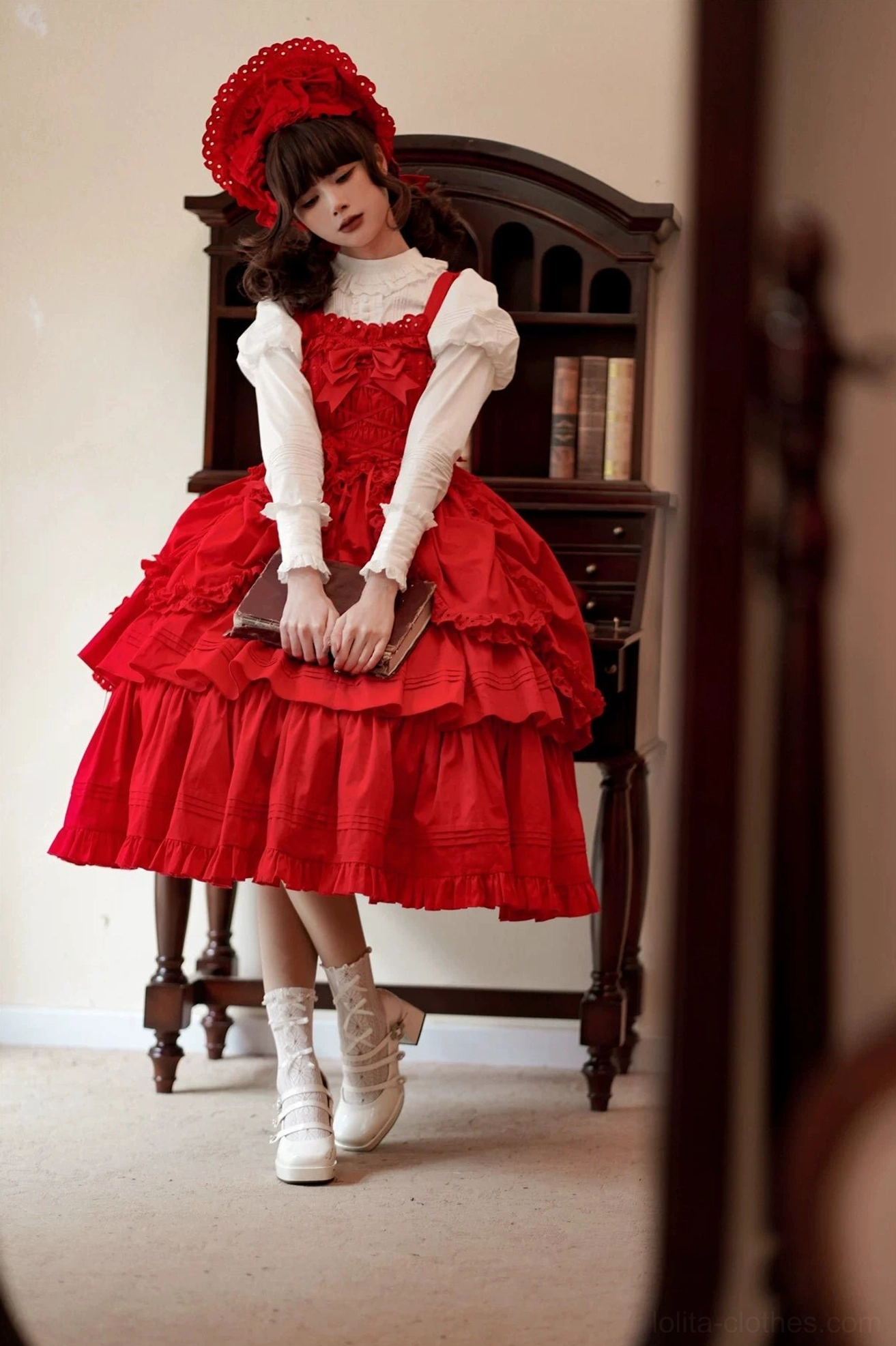 Detail shot of Gothic Lolita JSK removable accessories including chest bow, waist bow, and heart-shaped lace waist bag with pin fasteners