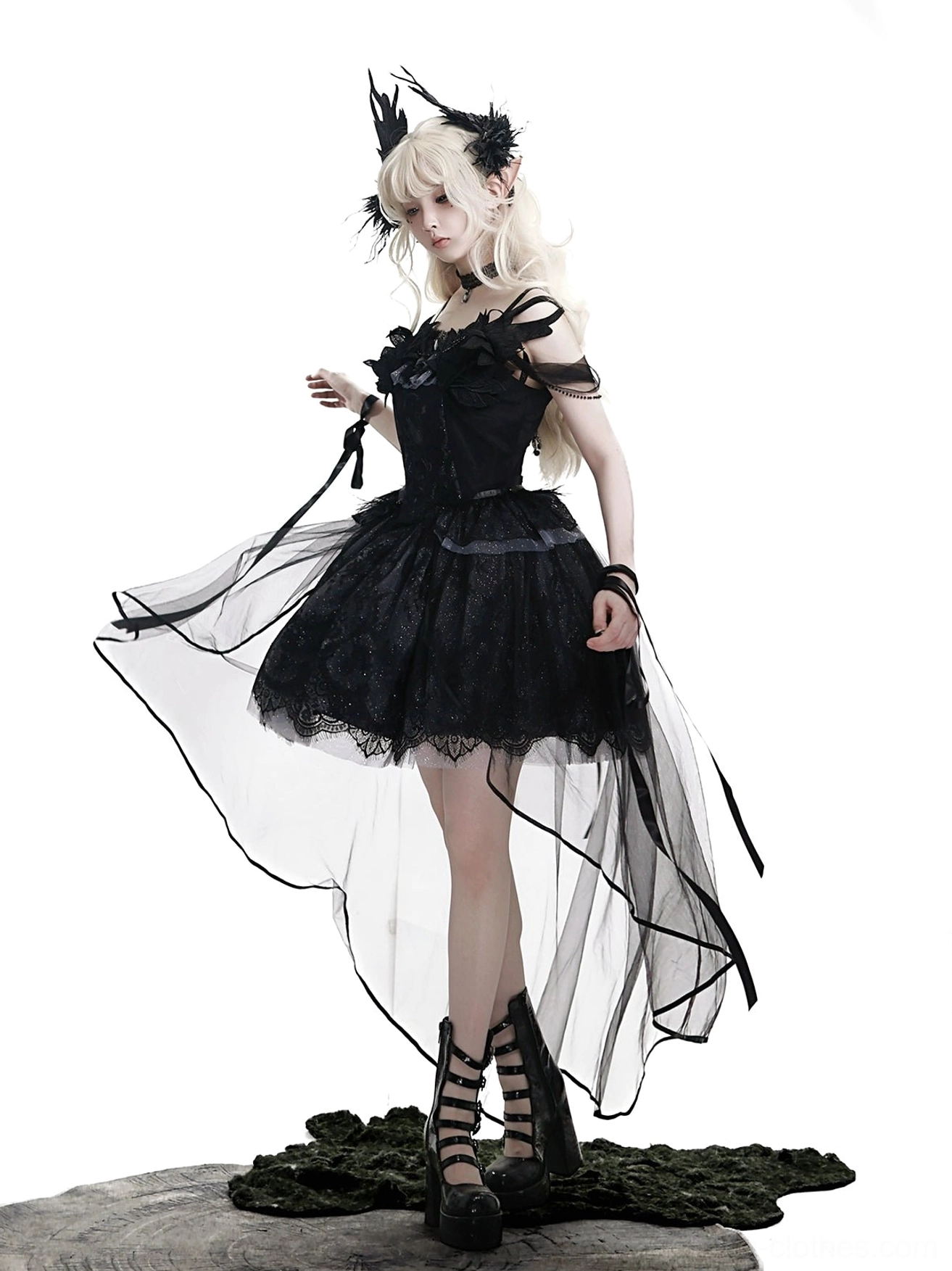 Black gothic lolita JSK dress detail view of detachable tulle train showing premium Swiss tulle construction, high-low hem layering, and subtle sparkle effect under light