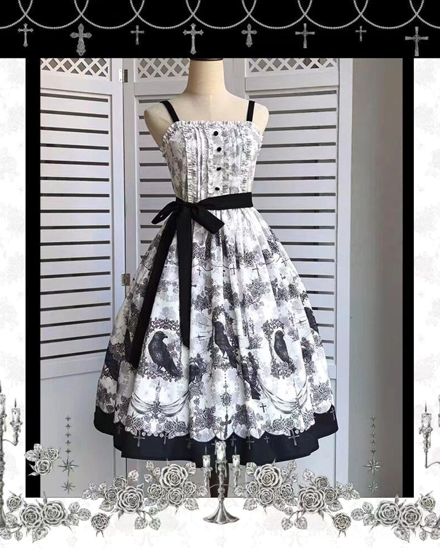 Gothic lolita JSK dress on mannequin display black crow print pattern ornate cross hem details adjustable straps front static shot