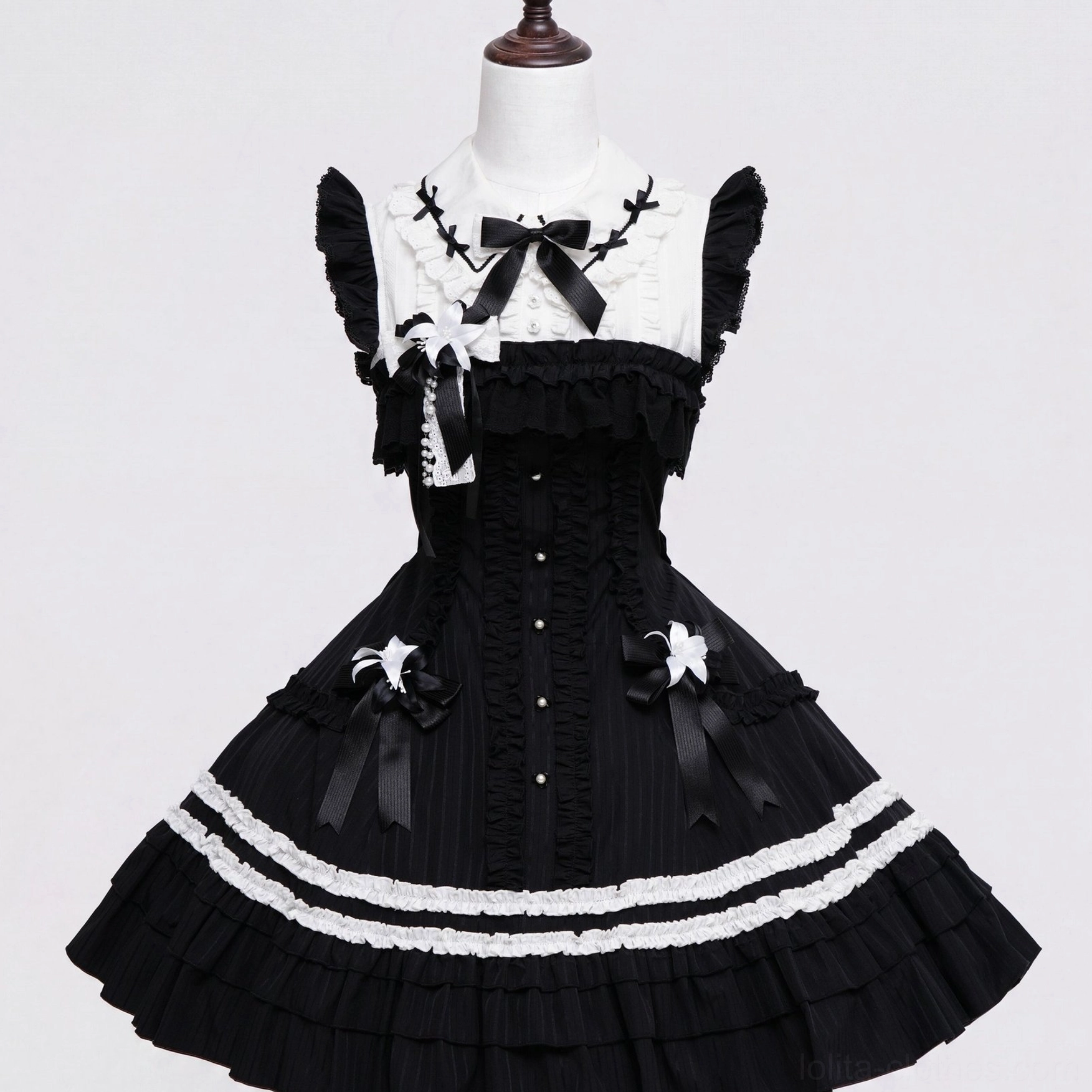 Gothic lolita JSK dress decorated with black white lily bow skirt accessories close-up front detail pleated bodice
