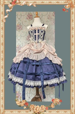 Gothic Lolita sleeveless JSK dress front view with detachable pink ruffled apron overlay on mannequin navy corset bodice cross pattern lace hem trim ribbon grid details