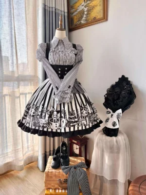 Gothic Lolita monster-printed jumper skirt with striped blouse displayed on dress form featuring Juliet sleeves, black bow collar, and puffed shoulders against bedroom window backdrop