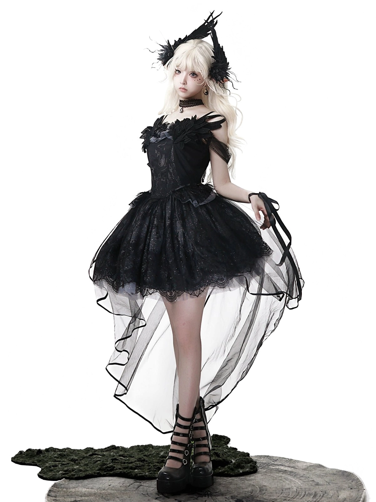 Black gothic lolita JSK dress close-up showing off-shoulder ruffled lace neckline construction, adjustable spaghetti strap attachment, and corset-style bodice structure