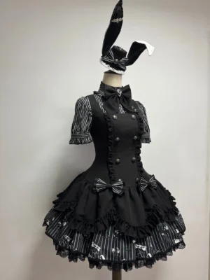 Gothic lolita striped JSK coordinate set with black and white vertical stripe pattern, double-layer ruffled skirt with skull print striped hem, rabbit ear hair accessory on dress form mannequin front view
