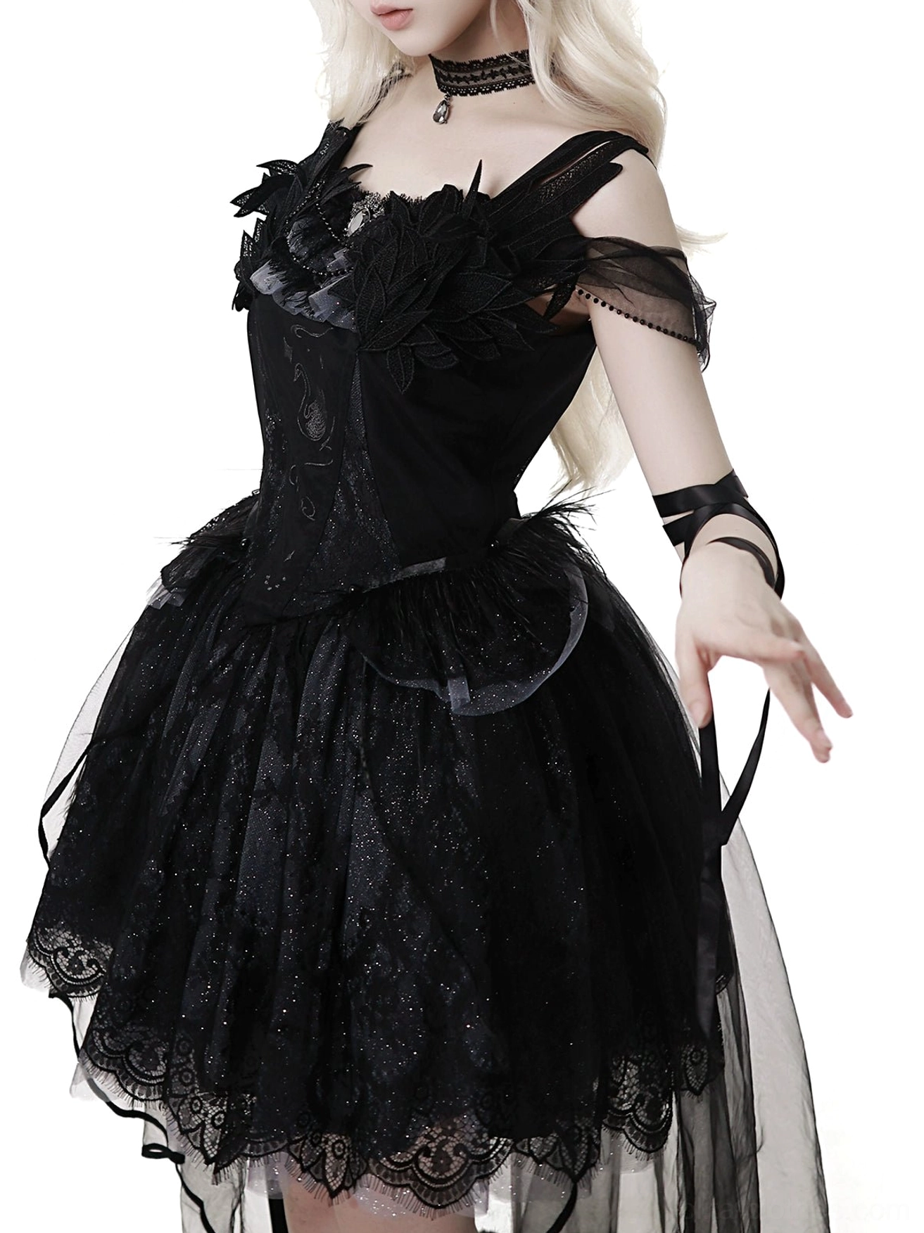 Black gothic lolita JSK dress fabric texture close-up showing Swiss tulle quality, nylon construction detail, and glitter embellishment on hem