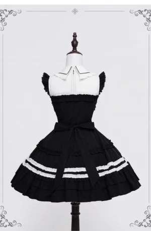 Gothic lolita black white ruffled JSK dress back view showing waist sash bow and open back design on mannequin
